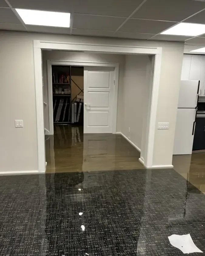 Water spread across a finished basement floor